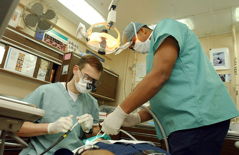 800px-US_Navy_030124-N-1328C-510_Navy_dentist_treats_patients_aboard_ship.jpg
